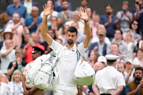 Djokovic waves after defeating Vit Kopriva in first round match